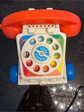 Fisher-Price Red Handset Rotary Fish Phone Toy with Blue Wheels